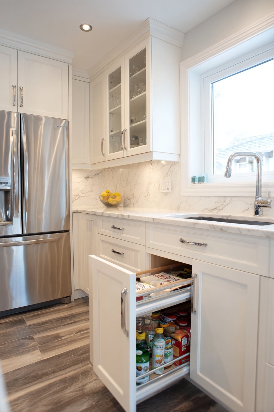 Bright White Kitchen with Glass-Front Upper Cabinets